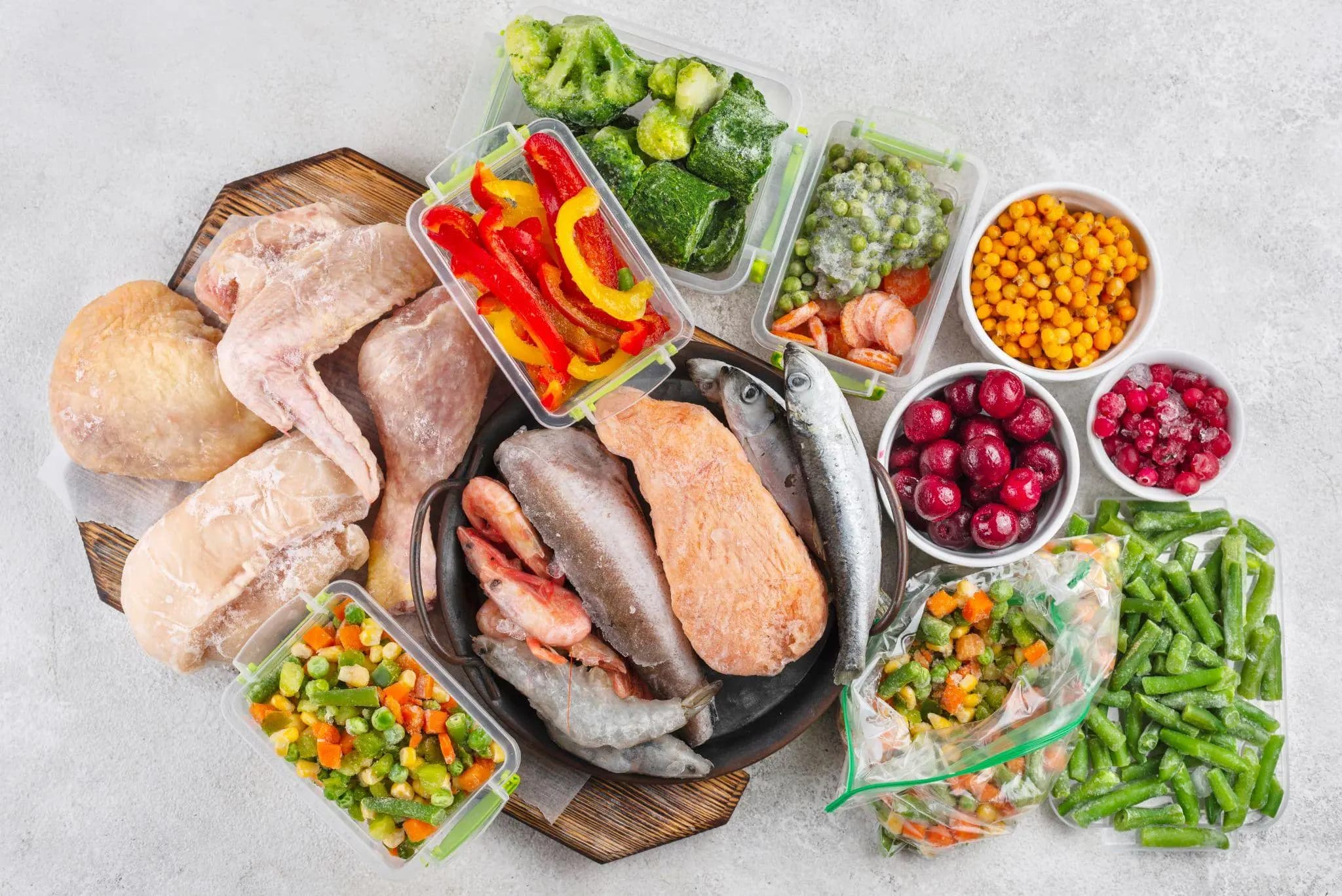 Assorted frozen foods including meat, fish, fruit and vegetables